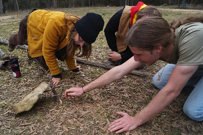 people making a trigger-fall trap