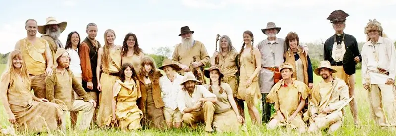 large group of men and women in buckskin dresses, shirts and pants